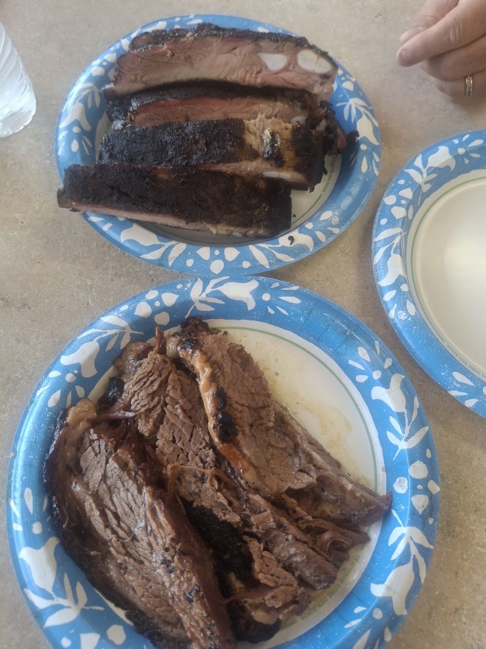 Pulled pork, ribs, and sausage options.